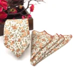 Burnt orange floral slim necktie on ecru background