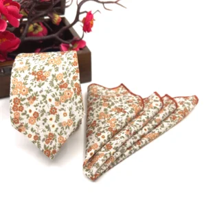 Burnt orange floral slim necktie on ecru background
